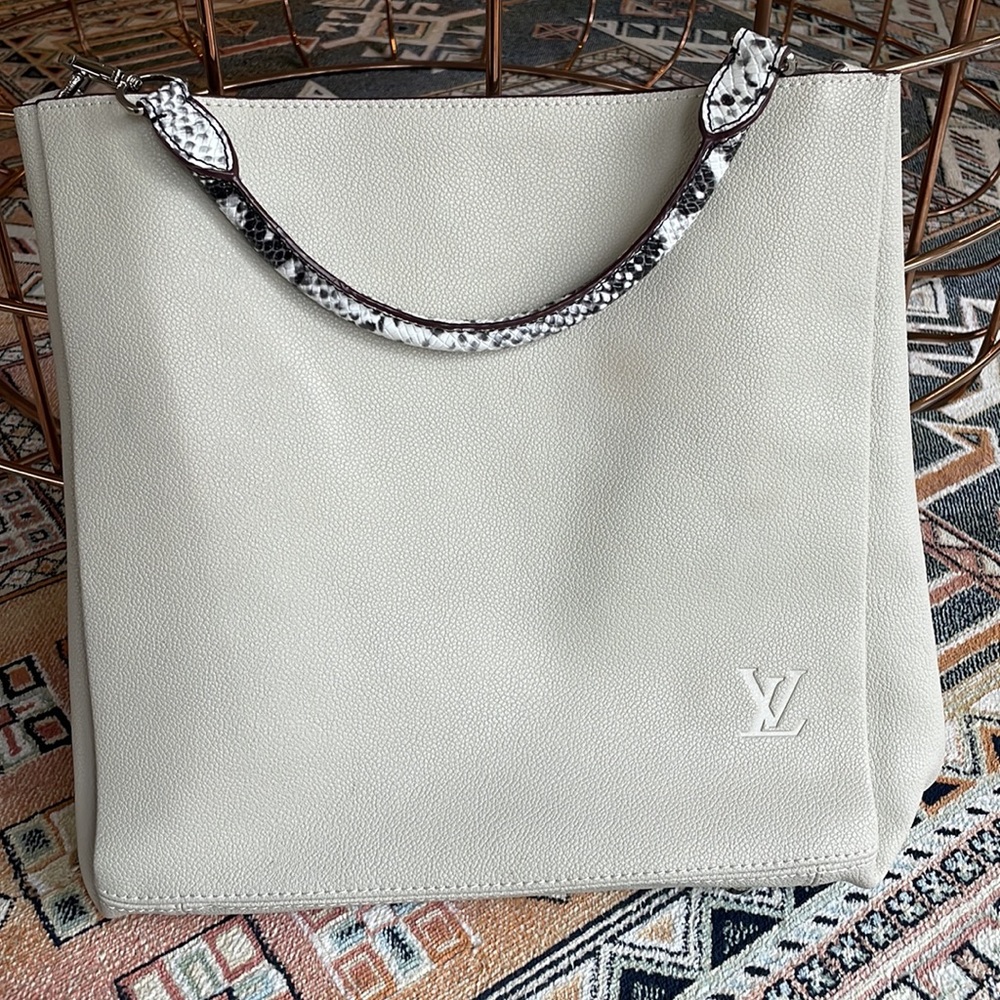 Light Gray Purse with leopard detail.